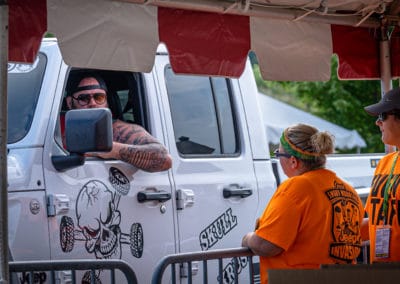 Event staff talk with attendee