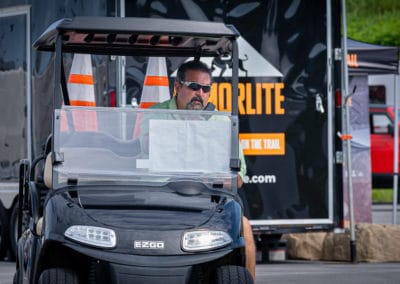 Jeep Invasion staff member in golf cart