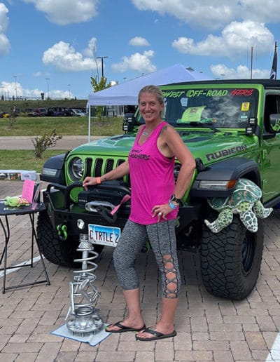 2021 Award Winner woman with Green Metallic colored Jeep